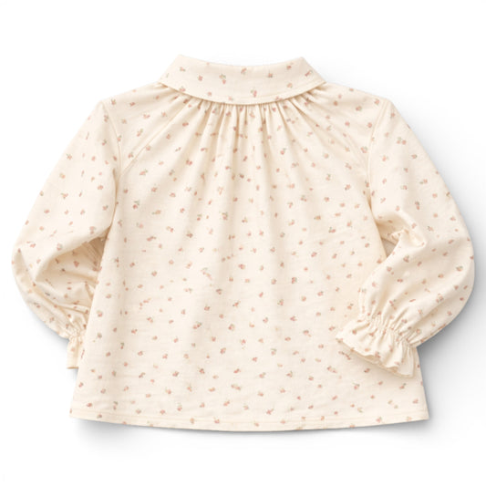 Brushed cotton children’s blouse with slim Peter Pan collar, button front, Raglan sleeve with frilled cuff details.