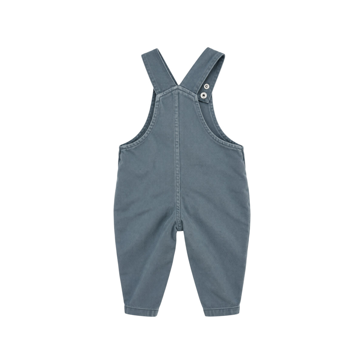 Back view of Arlo blue children's dungarees showing adjustable shoulder straps, central seam and tapered legs.
