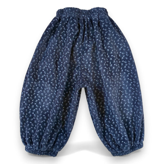 Back view of navy floral needlecord children’s pantaloons with elasticated cuffs and full balloon volume by That’s Not Fair London