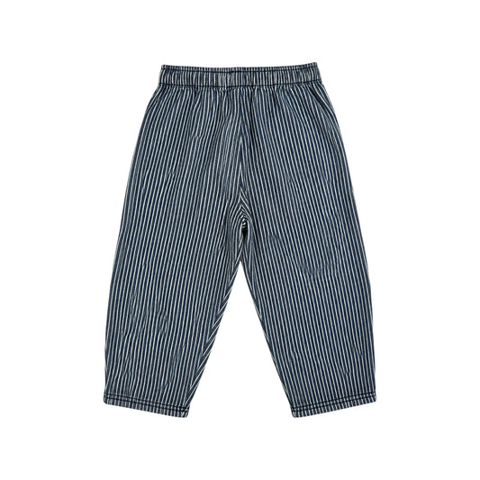 A pair of children's loose-fitting pants with vertical navy and white stripes, featuring an elastic waistband and cuffed ankles, shown against a plain white background.