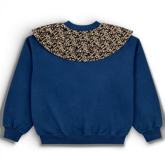 Blue children’s double ply cotton jersey jumper with floral bib detail, balloon cut and ribbed trims - Back view