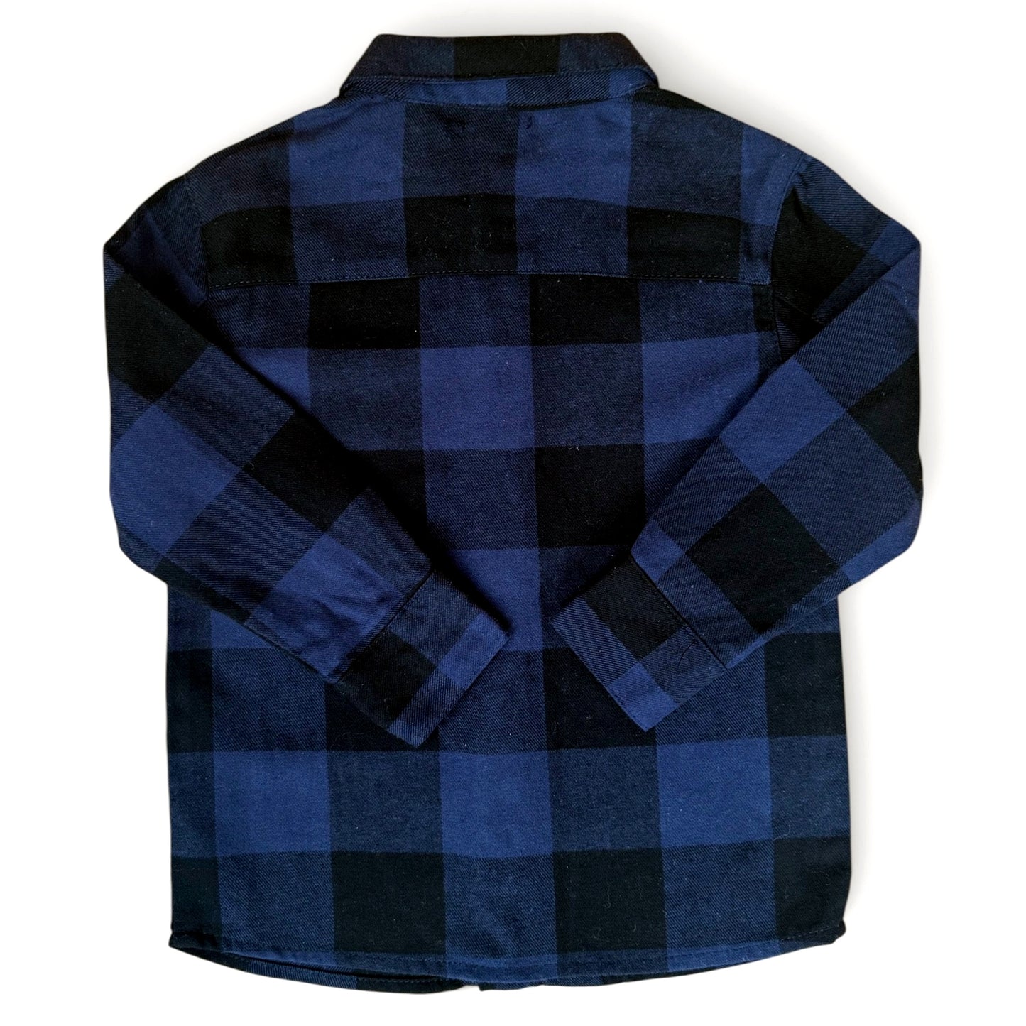 Back view of slim navy buffalo check wool-cotton children’s shirt with curved hem and dropped shoulders by That’s Not Fair London.