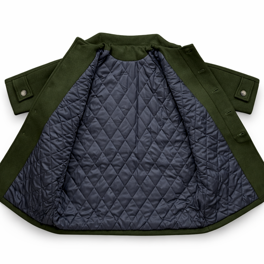 Olive green boiled wool children’s pea coat with raglan sleeves, concealed front placket, three front pockets and quilted lining
