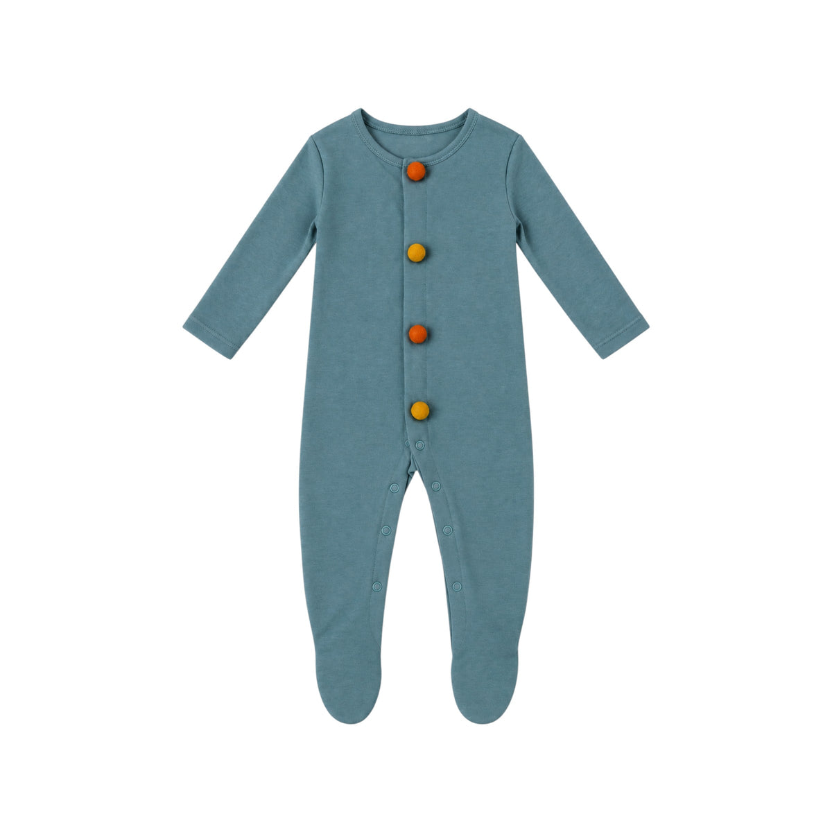 Merla Bobble Romper by That’s Not Fair London in muted blue, with four mustard and burnt orange felted wool bobble buttons, long sleeves and integrated feet