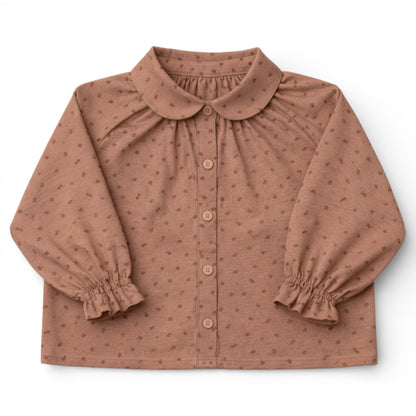 Brushed cotton children’s blouse with slim Peter Pan collar, button front, Raglan sleeve with frilled cuff details.