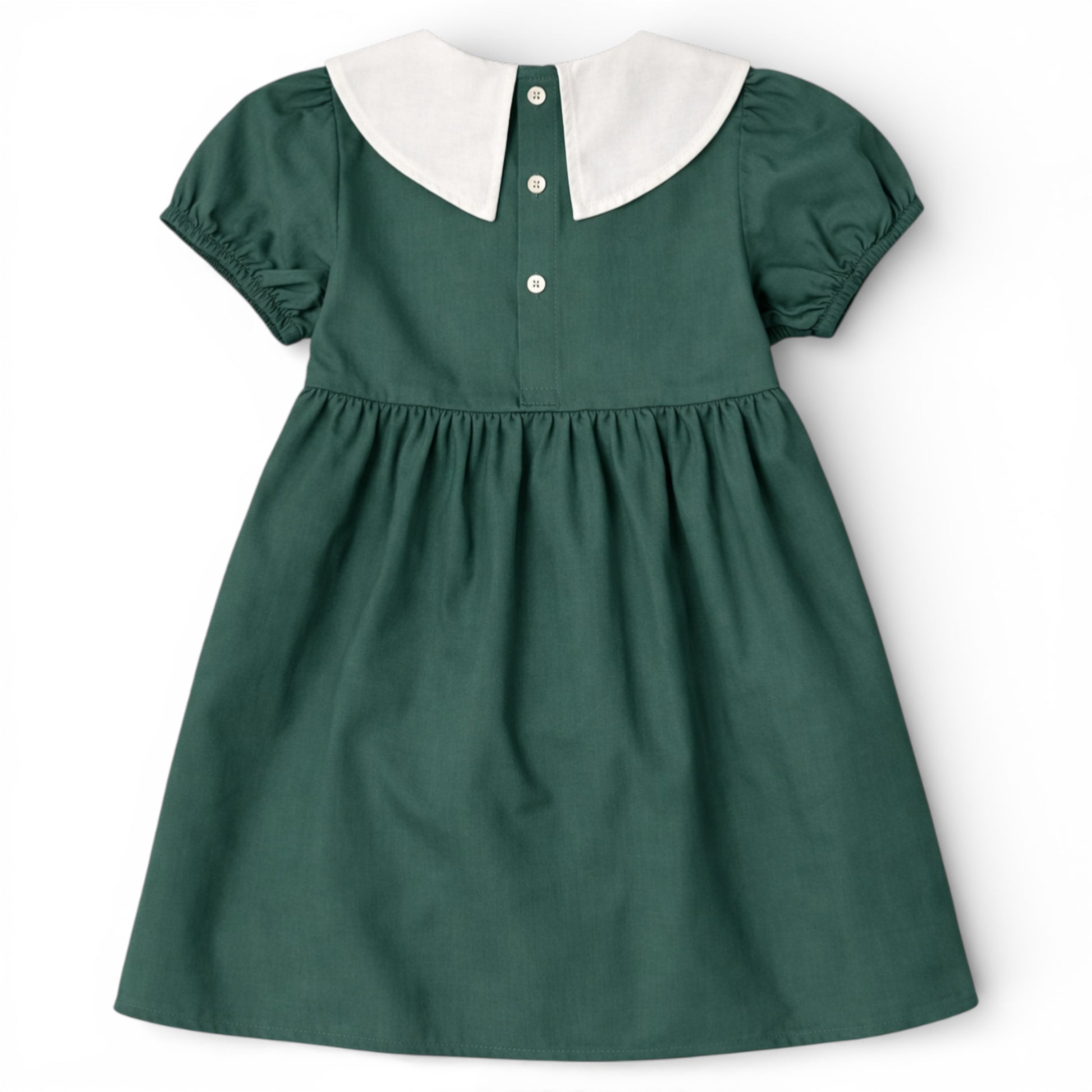 Back view of green cotton empire line smock dress with Peter Pan collar