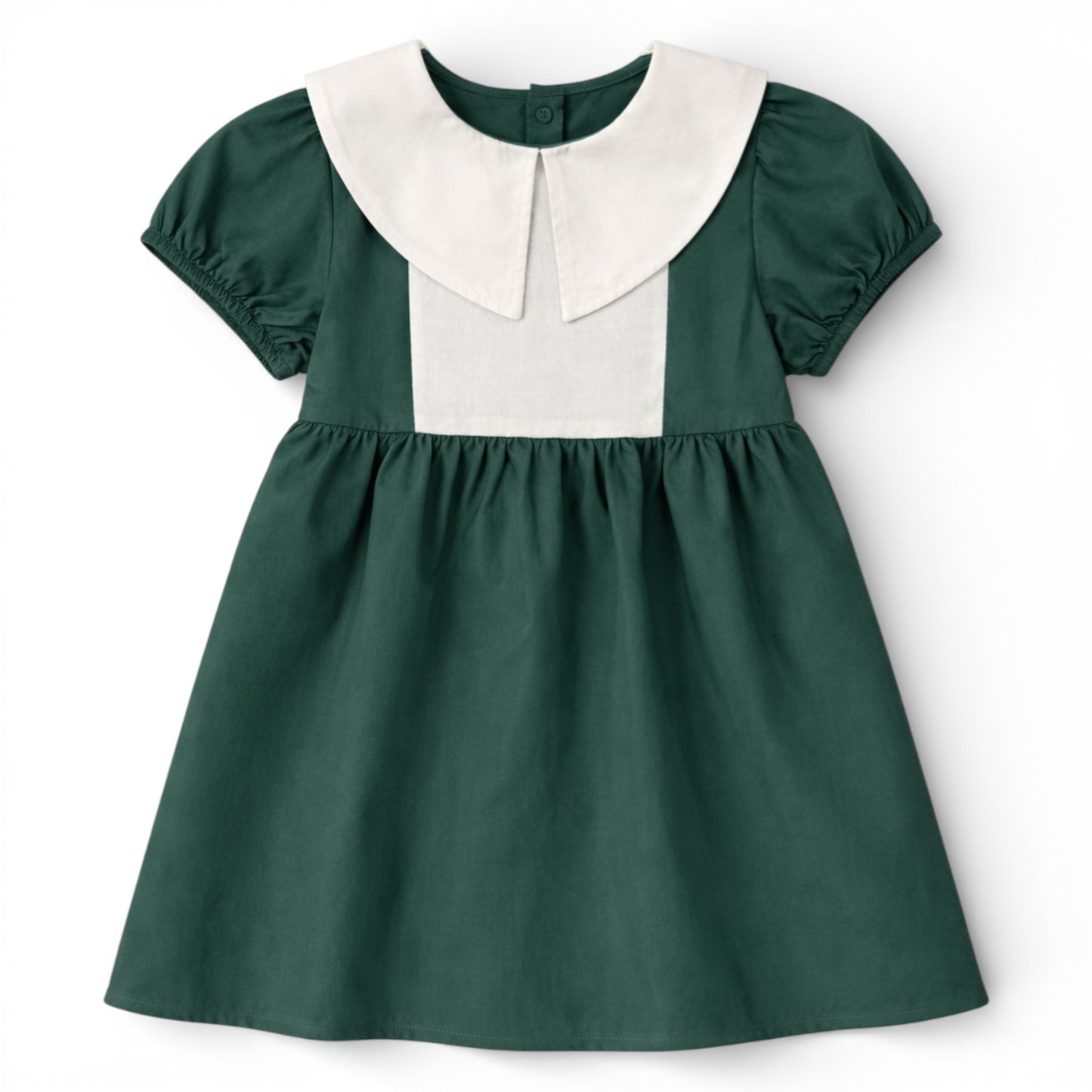 Front view of green cotton empire line smock dress with Peter Pan collar