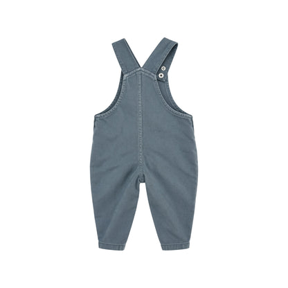 Back view of Arlo blue children's dungarees showing adjustable shoulder straps, central seam and tapered legs.