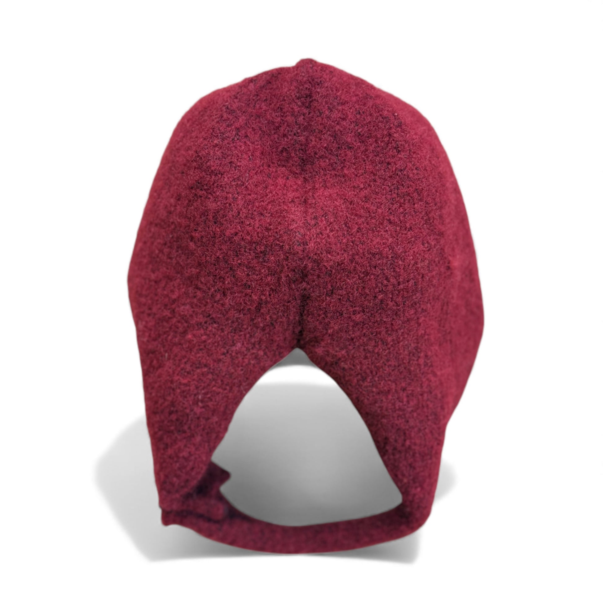 Burgundy wool children’s hat with close curved fit — back view.