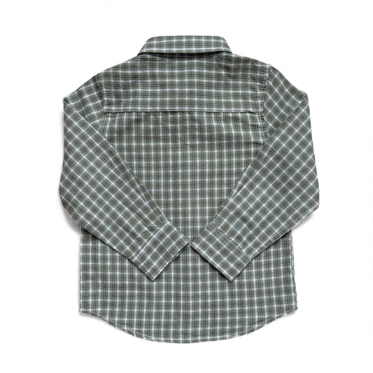 Green check cotton children’s shirt with long sleeves, button cuffs and curved hem — back view.
