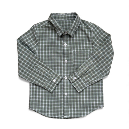 Green check cotton children’s shirt with collar, front buttons and single chest pocket — front view.