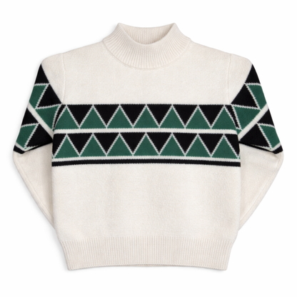 Children’s cream knit jumper with short turtle neck, drop shoulders, and green and black Fair Isle–inspired pattern across the chest.