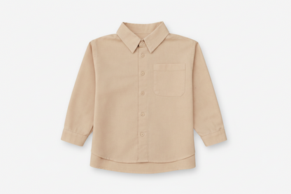 Children’s brushed cotton shirt with patch pocket and dress hem.
