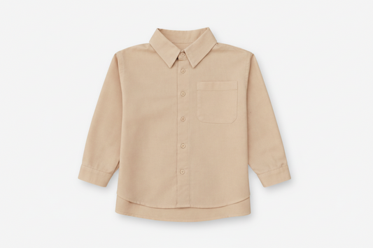 Children’s brushed cotton shirt with patch pocket and dress hem.
