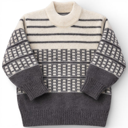 Children’s patterned knit jumper with drop shoulder and slight turtle neck.