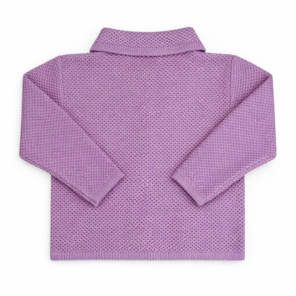 Back view of children’s waffle-knit cardigan with straight hem and relaxed sleeves, photographed flat on a white background.