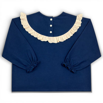 Navy children’s blouse with frilled lace collar, boxy fit and elasticated sleeve cuffs by That’s Not Fair London
