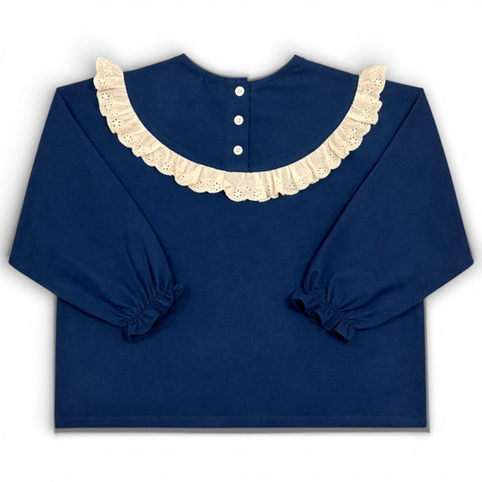 Navy children’s blouse with frilled lace collar, boxy fit and elasticated sleeve cuffs by That’s Not Fair London