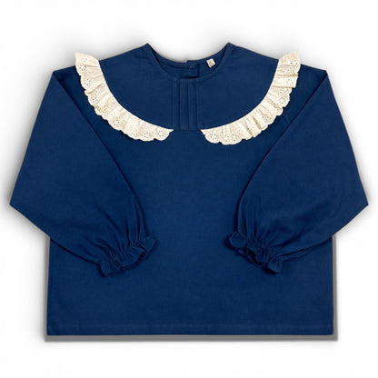 Navy children’s blouse with frilled lace collar, boxy fit and elasticated sleeve cuffs by That’s Not Fair London