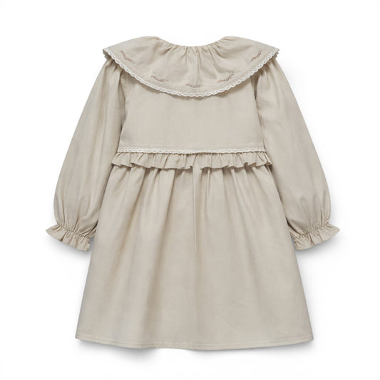 Beige dress with ruffled collar on a white background