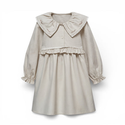 Beige dress with ruffled collar on a white background