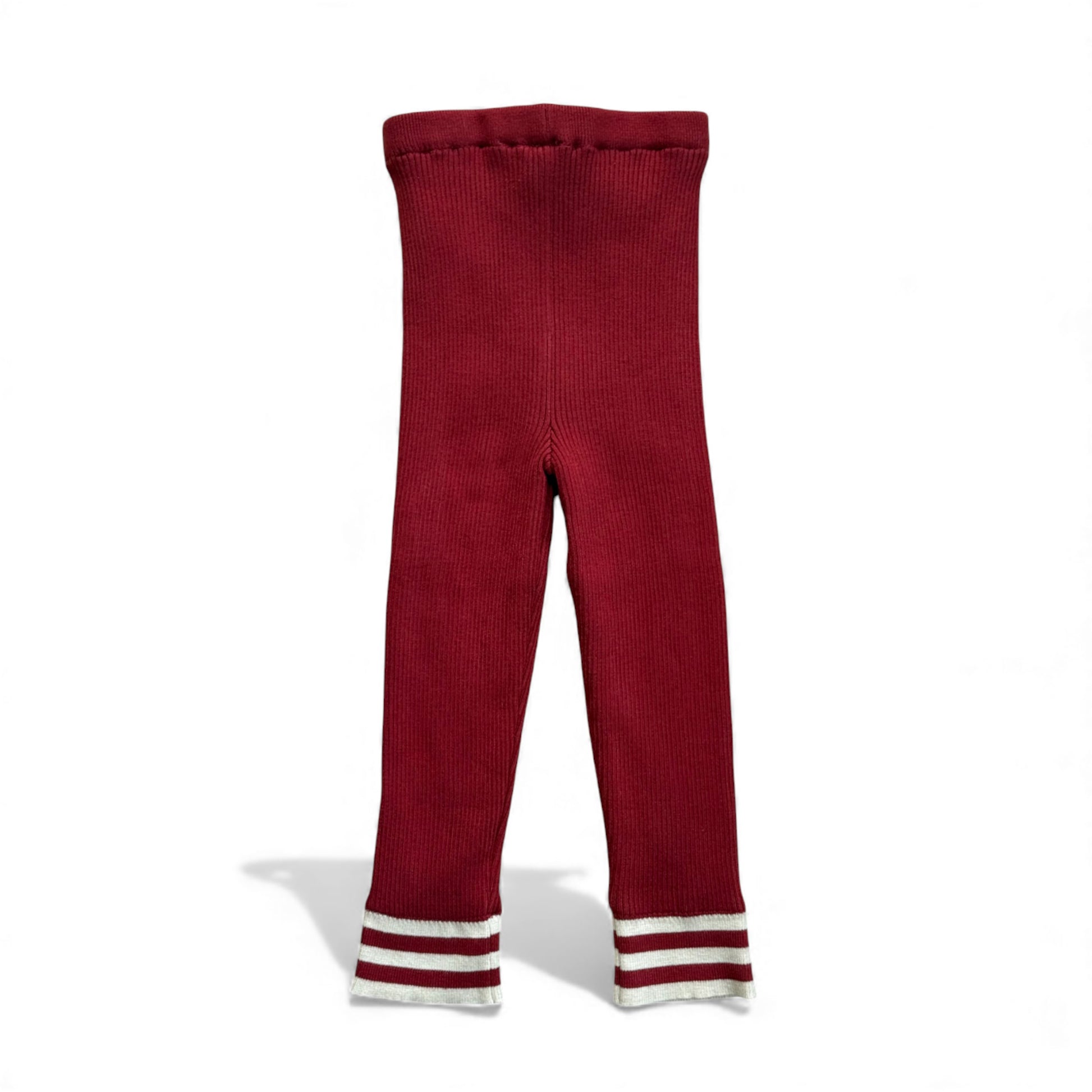 Red ribbed knitted, fleece line children’s leggings with double-stripe cuffs laid flat on white background.”

“