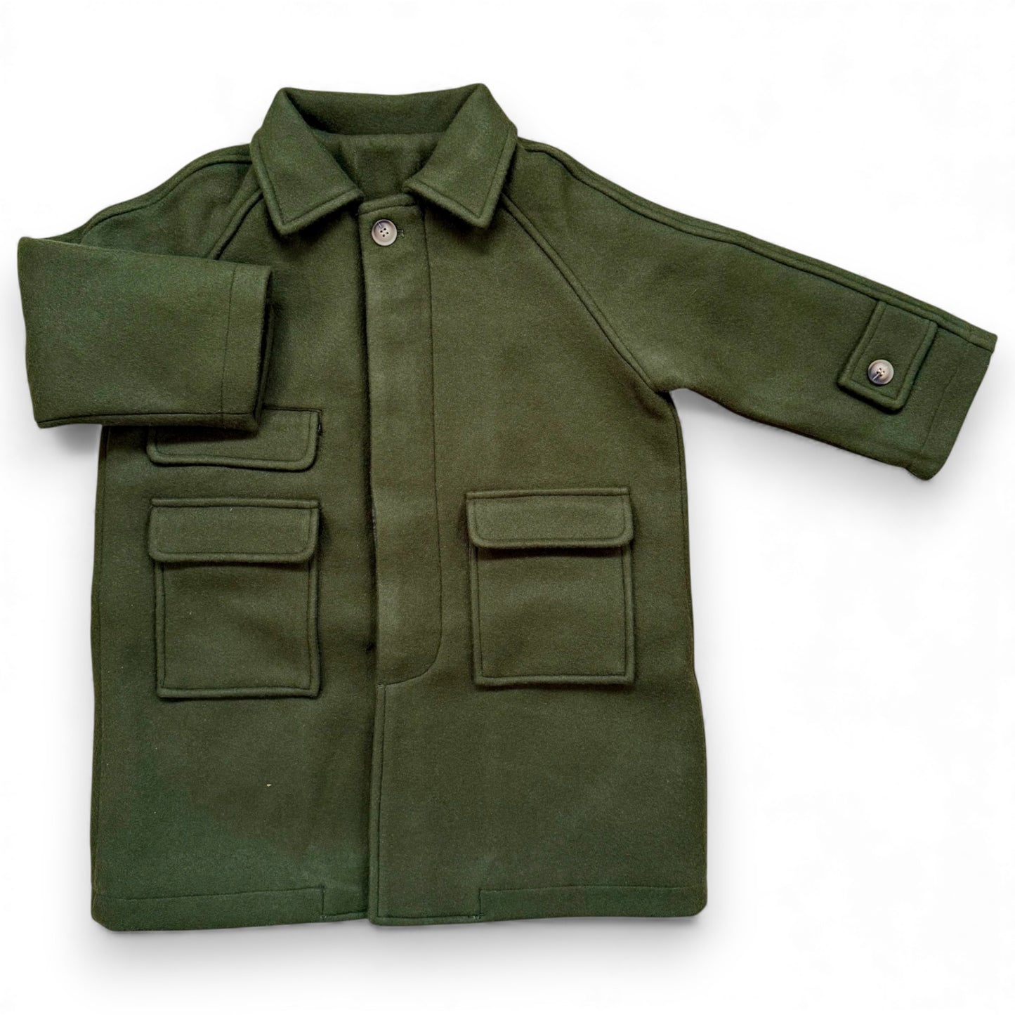 Olive boiled wool children’s pea coat with raglan sleeves, flap pockets, sleeve tabs and quilted lining.