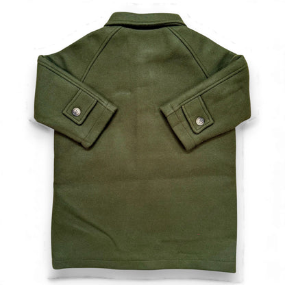 Olive boiled wool children’s pea coat with raglan sleeves, flap pockets, sleeve tabs and quilted lining.