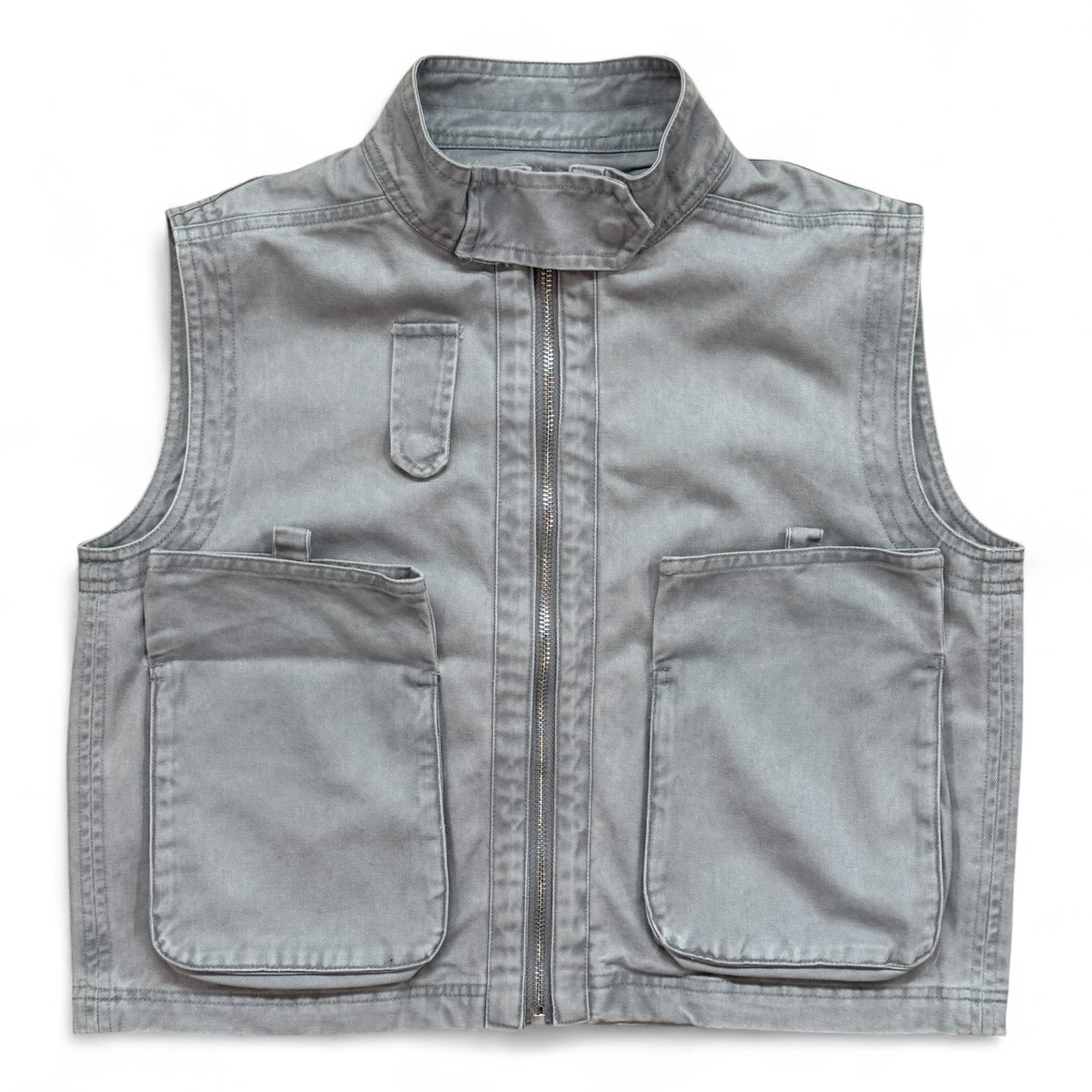 Close-up of washed-denim gilet pocket and stitching by That’s Not Fair London