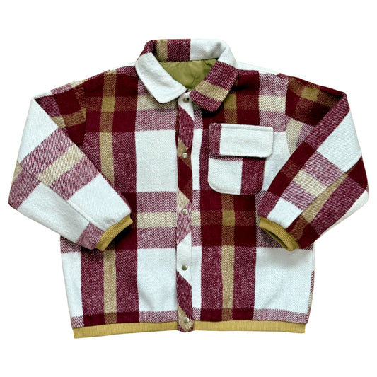 Checked wool-blend children’s shacket with ribbed cuffs, rounded collar and popper fastening.