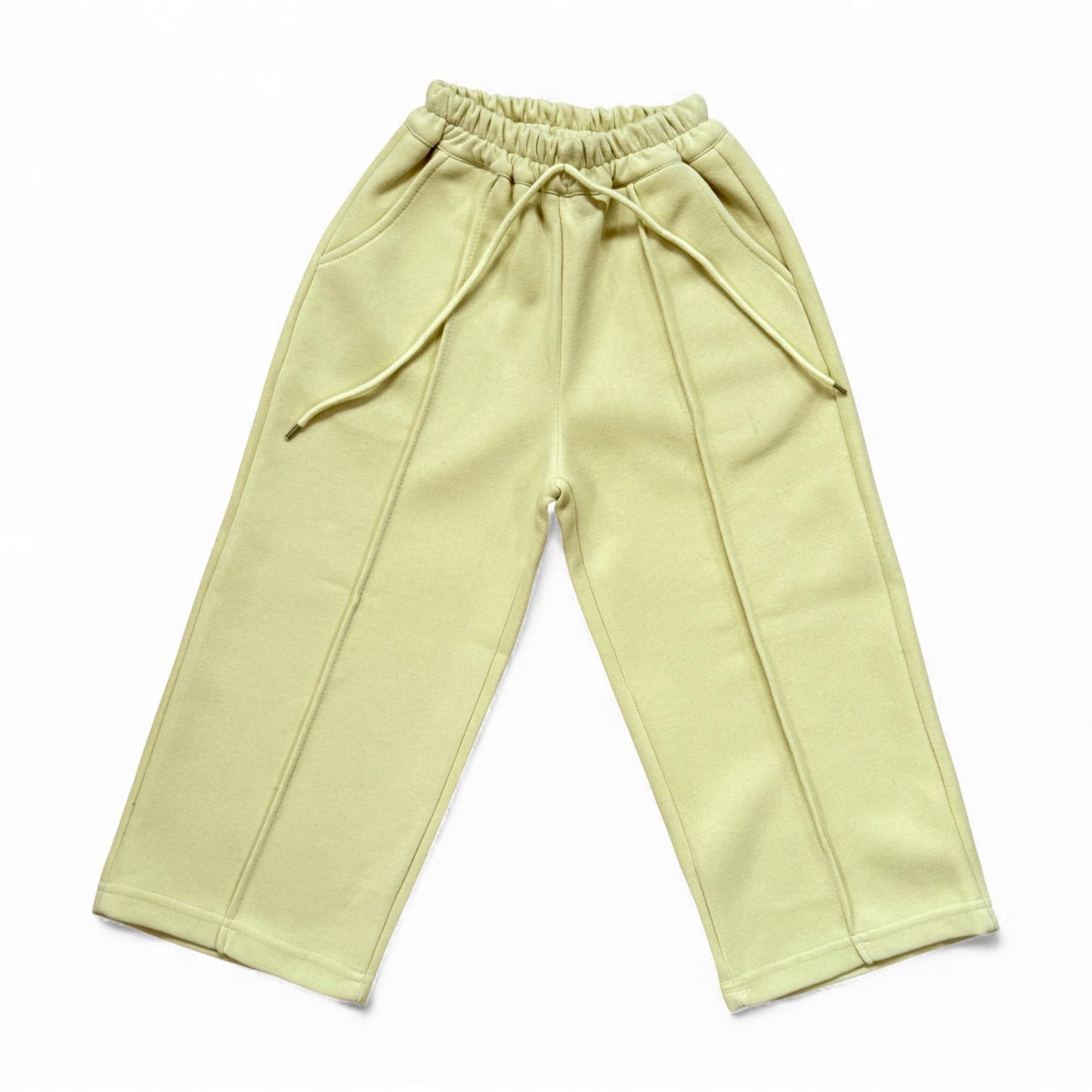 Sherbet-lemon organic cotton children’s tracksuit with funnel-neck top, mock T-shirt underlayer with drawstring, and straight-leg stitched-pleat trousers.