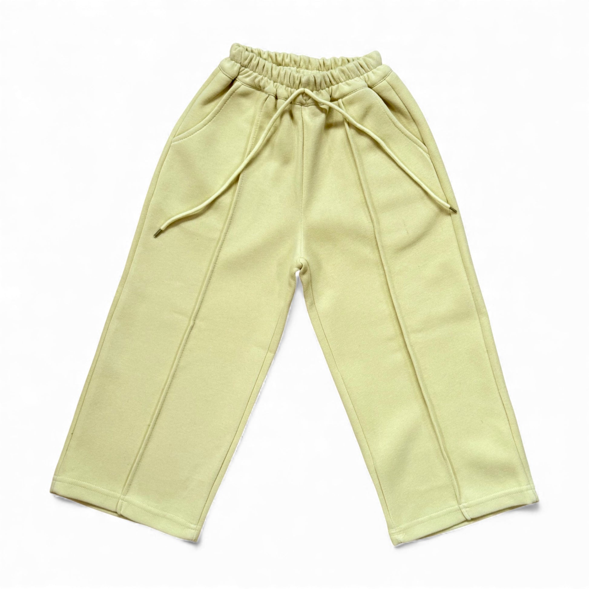 Sherbet-lemon organic cotton children’s tracksuit with funnel-neck top, mock T-shirt underlayer with drawstring, and straight-leg stitched-pleat trousers.