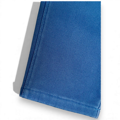 Close-up of blue cotton drill fabric and stitched hem on Nour Pants by That’s Not Fair London