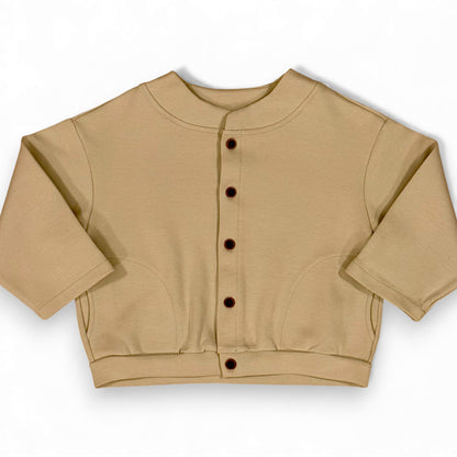 Folami Jacket in sand — front view, heavyweight cotton jersey with crescent pockets
