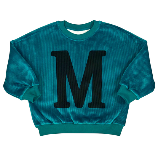Front view of the high-green Mario Jumper with bold Tuscan-style M across the chest.
