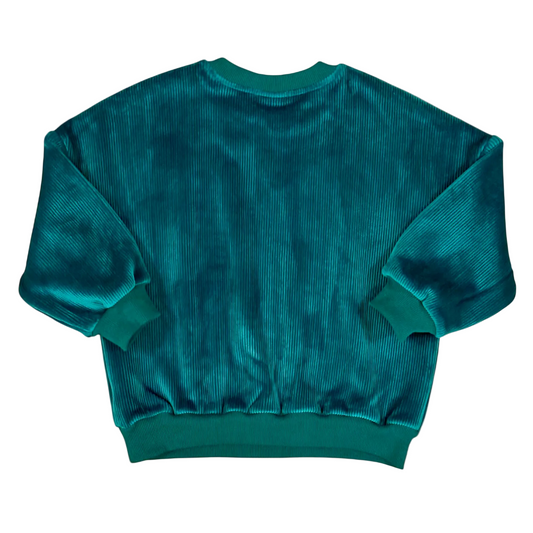 Back view displaying velvety pile and ribbed hem details.