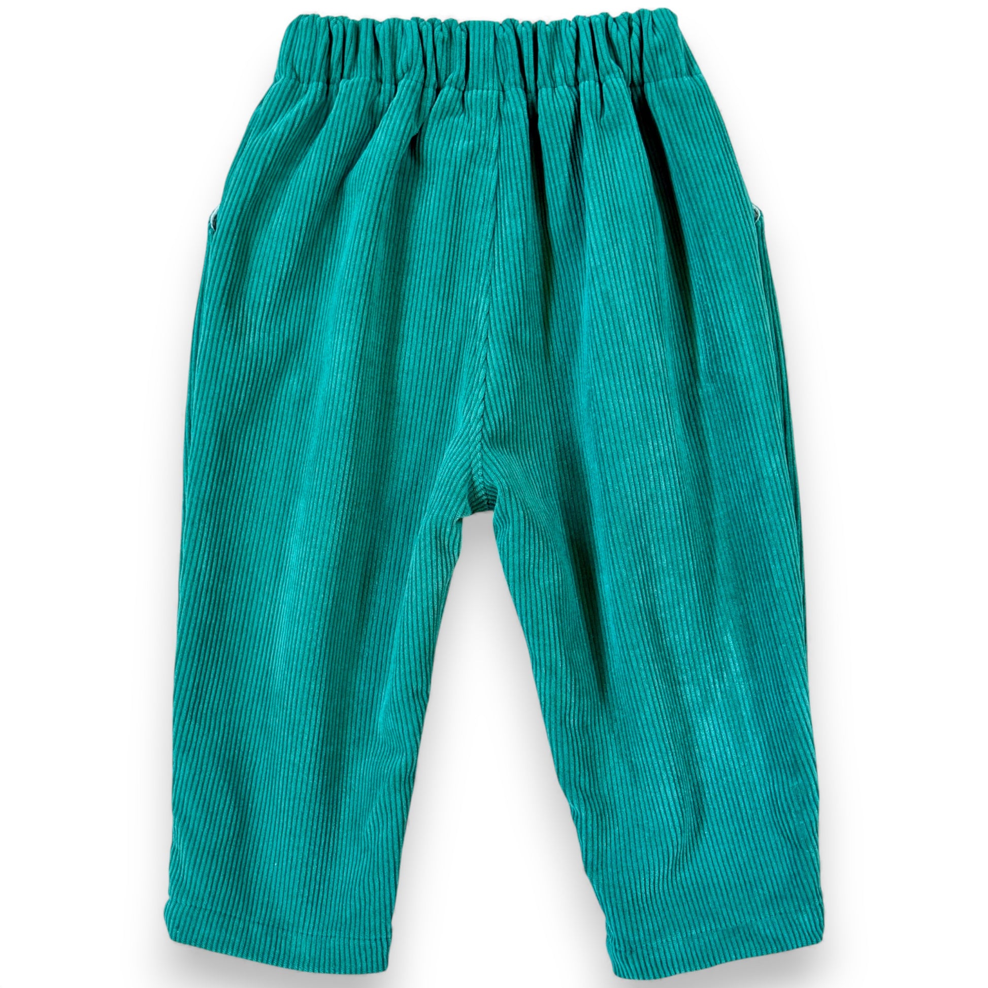 Apple green children’s balloon trousers with crossover waist panel and elastic waistband.