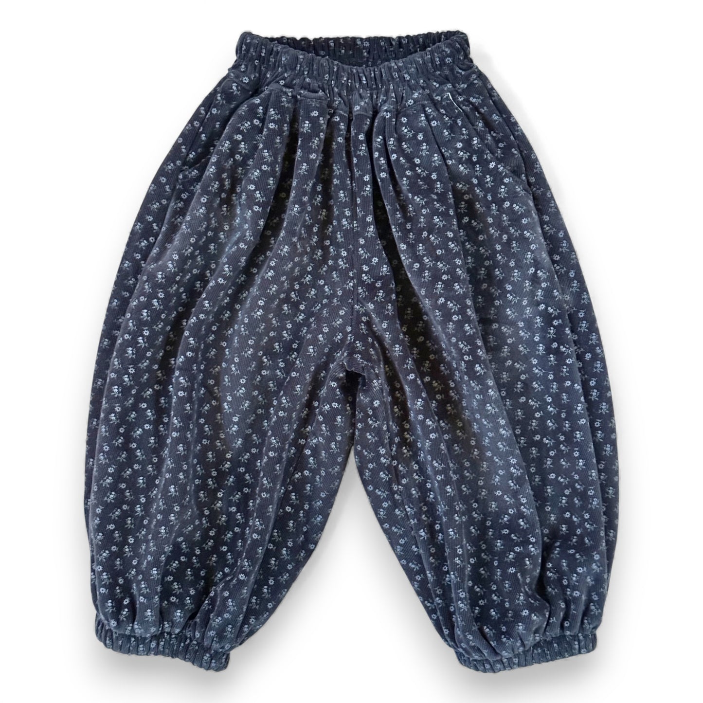 Navy floral needlecord children’s pantaloons with elastic waistband, slant pockets and lined balloon silhouette by That’s Not Fair London