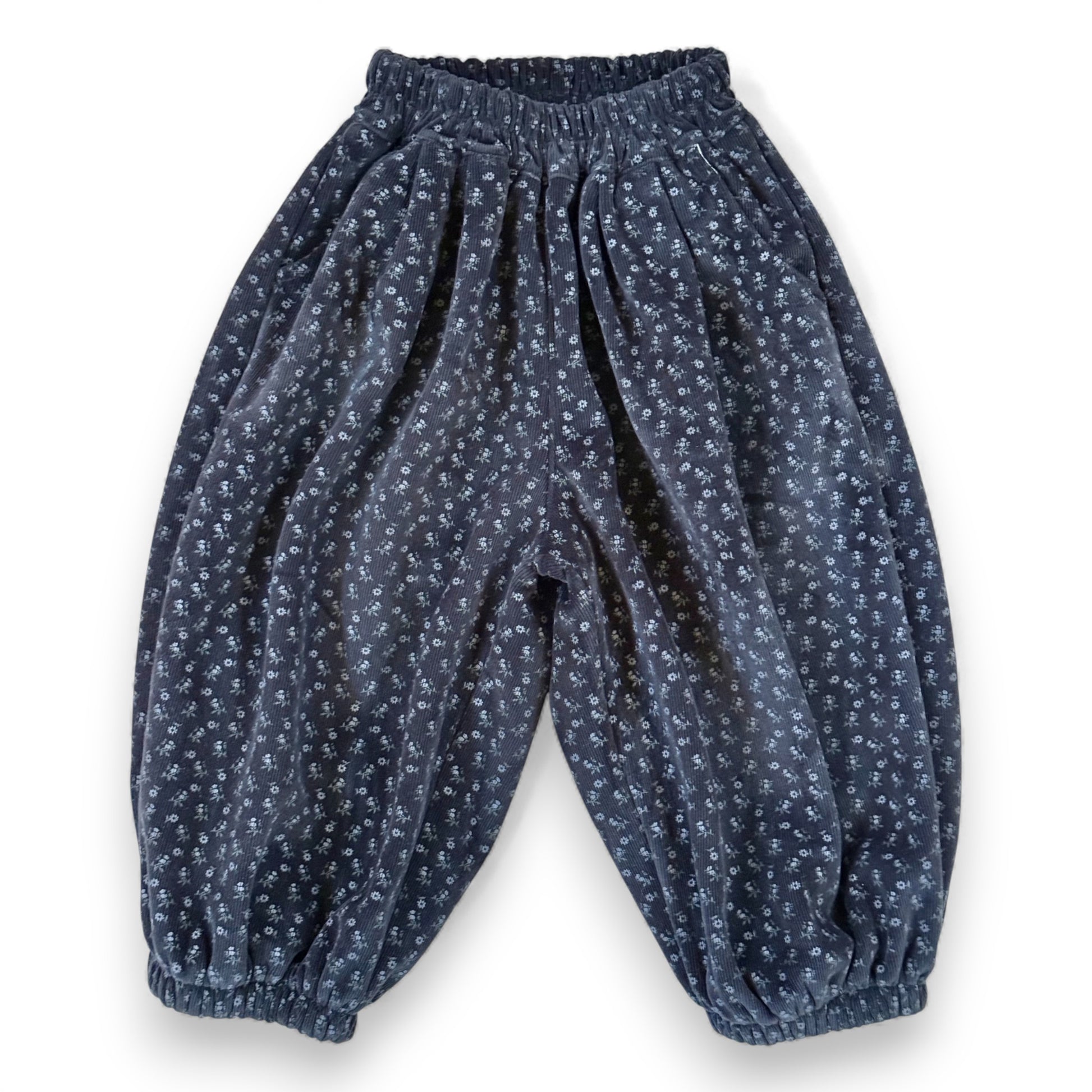 Navy floral needlecord children’s pantaloons with elastic waistband, slant pockets and lined balloon silhouette by That’s Not Fair London