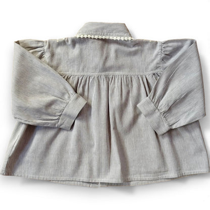 Back view of children’s pinstripe A-line blouse with deep gathered yoke and full sleeves