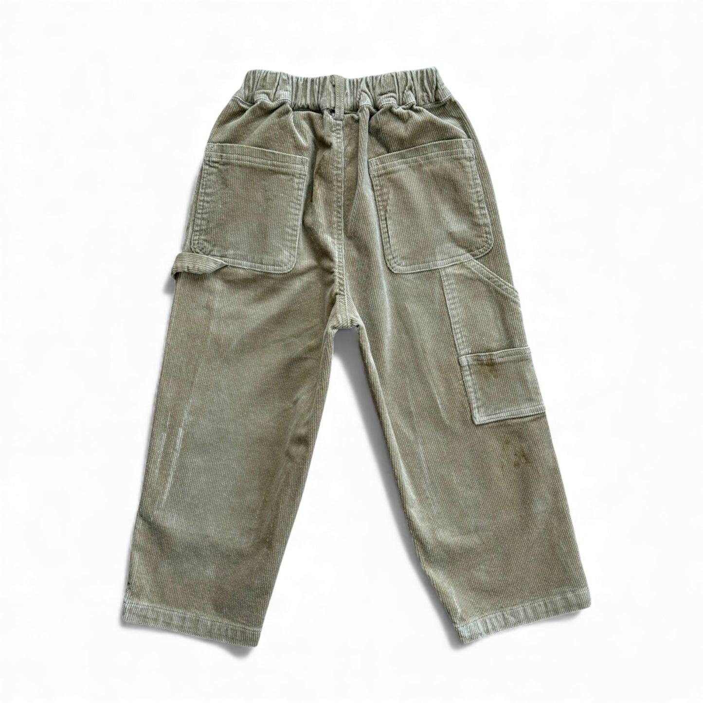 Sand corduroy children’s trousers with patch pockets, elasticated waistband and cargo pocket — back view.