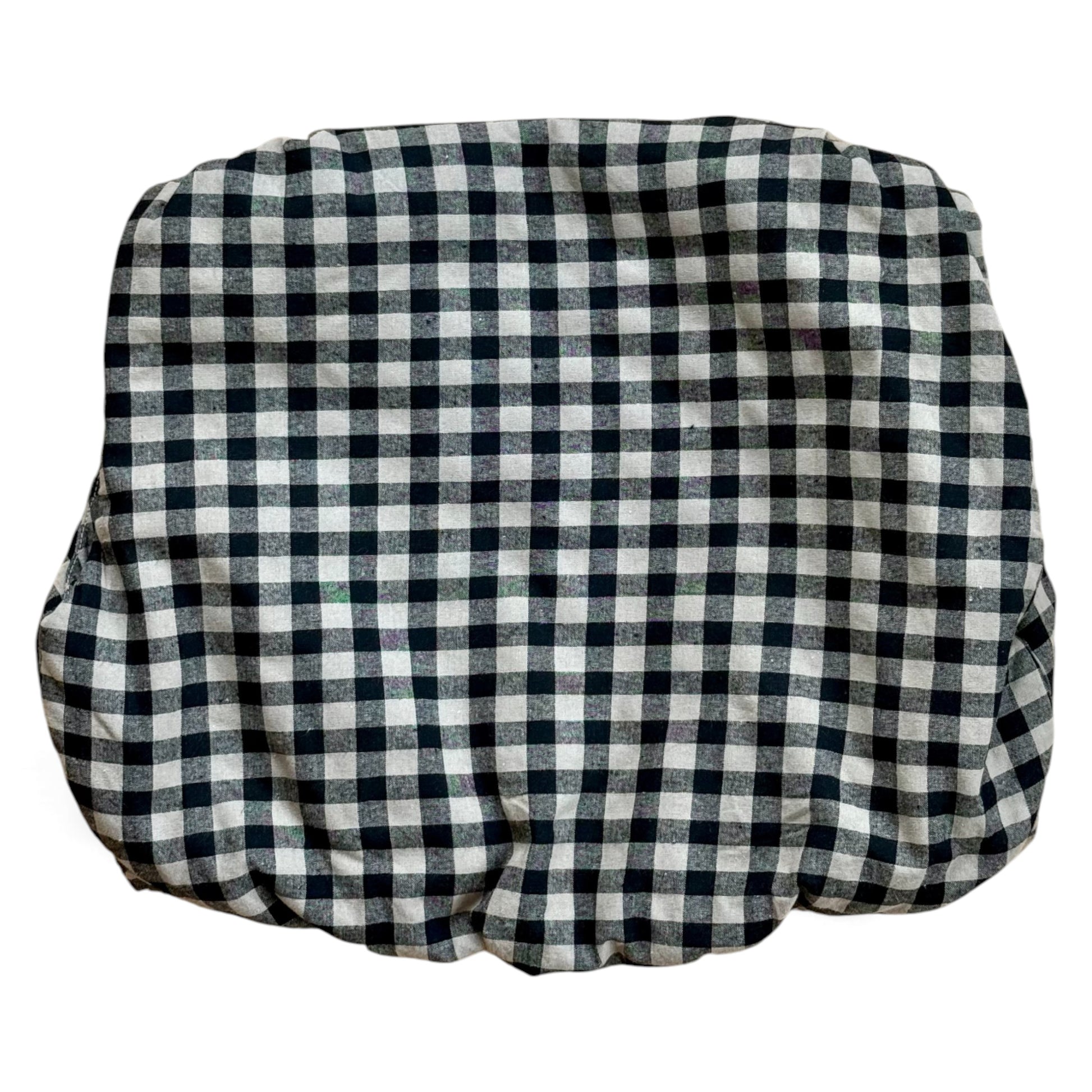 Black-and-cream gingham quilted children’s gilet with petal-shaped pockets and popper fastening.