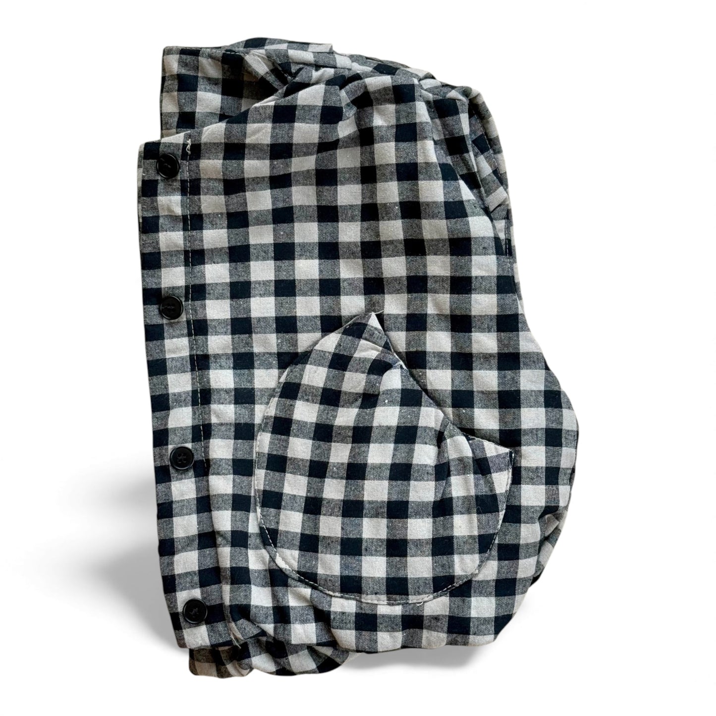 Black-and-cream gingham quilted children’s gilet with petal-shaped pockets and popper fastening.