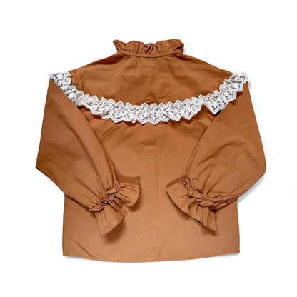 Back view of Della Blouse featuring lace yoke detail and voluminous sleeves by That’s Not Fair London