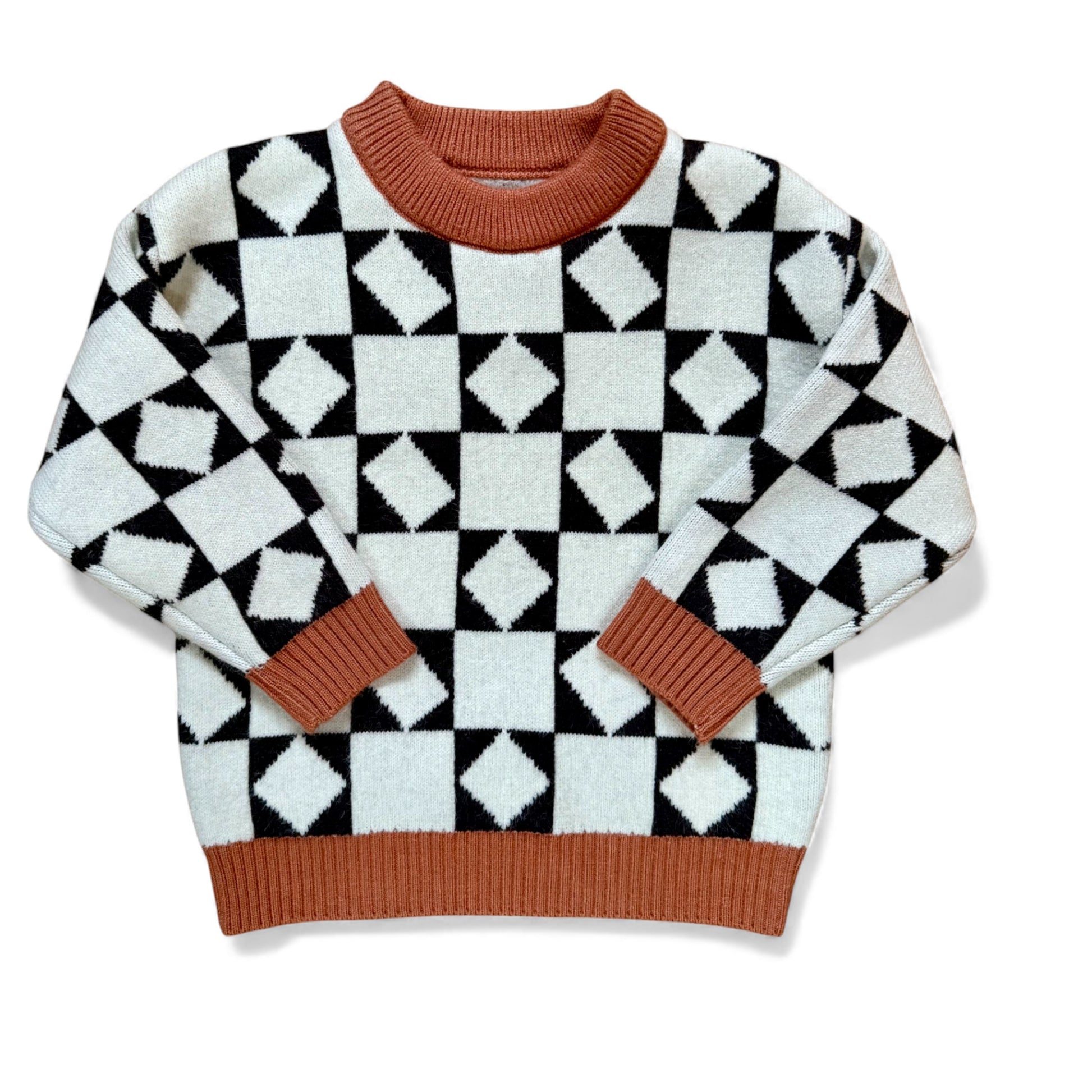 Front view of Earnest Jumper by That’s Not Fair London, graphic checkerboard knit with rust ribbed trim