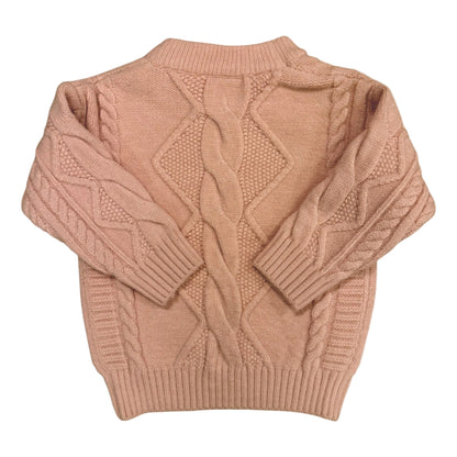 Back view of the Beatrix Jumper showing textured knit panels and neat silhouette