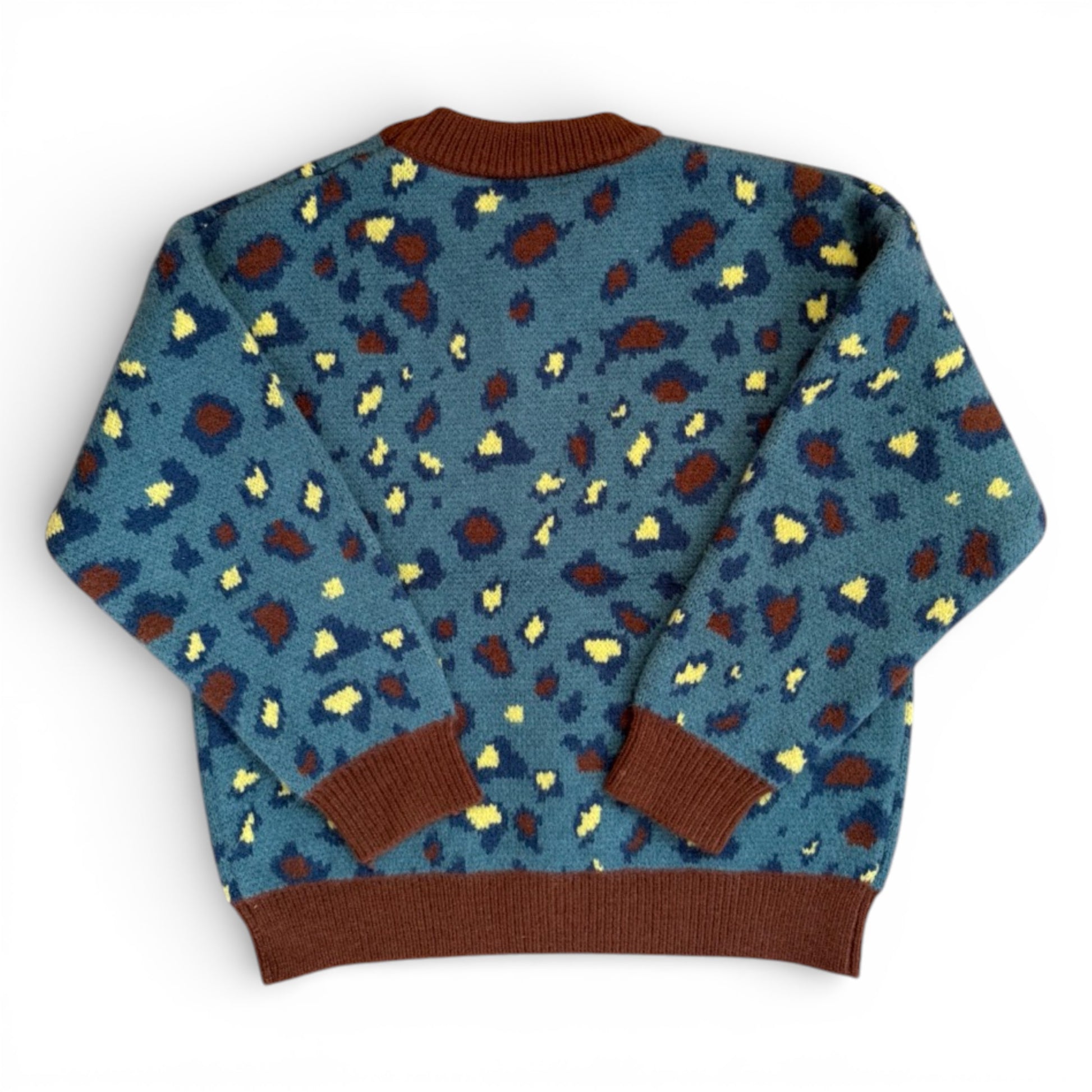 Back view of patterned children’s knit jumper with ribbed cuffs and hem