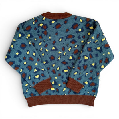 Back view of patterned children’s knit jumper with ribbed cuffs and hem