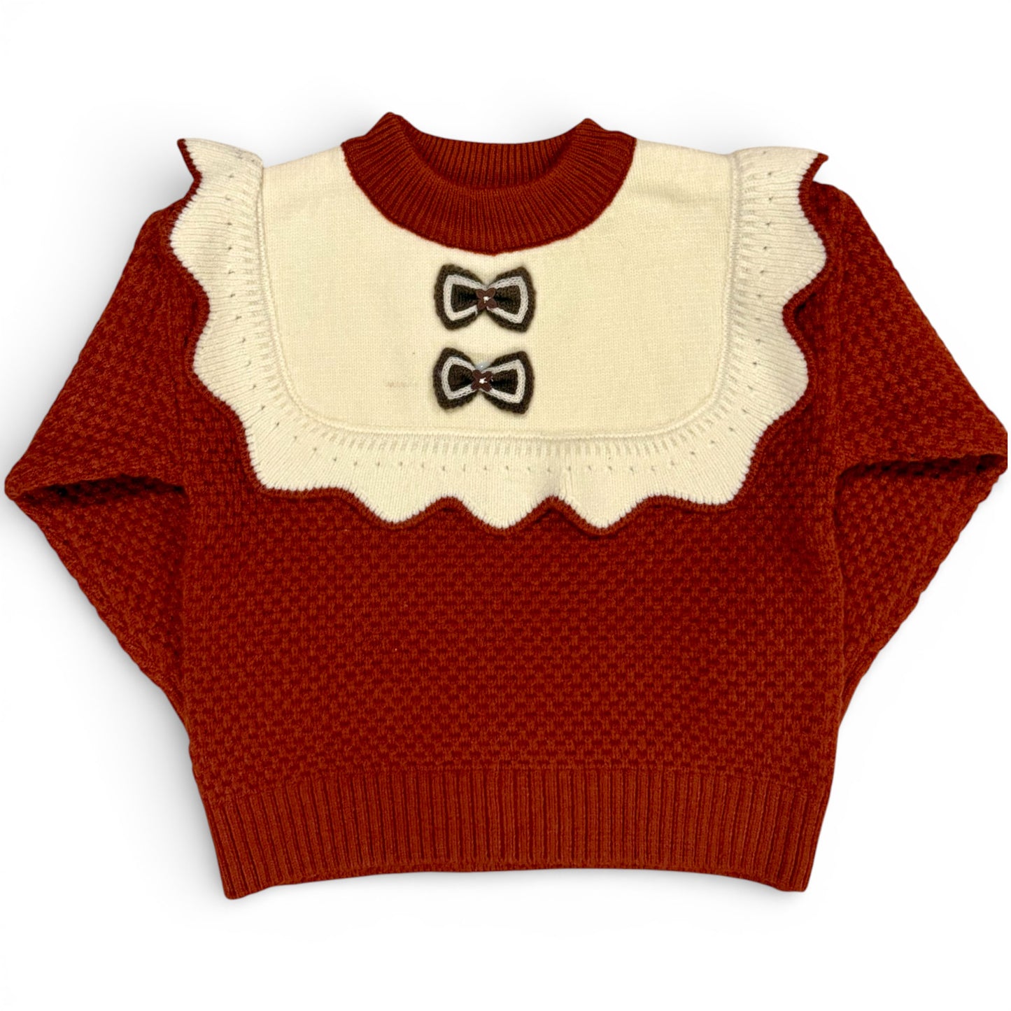 Rummie Jumper in white Victorian-inspired children’s waffle stitch knit with mock bib, frill trim and bow detailing by That’s Not Fair London. Heritage children’s knitwear 