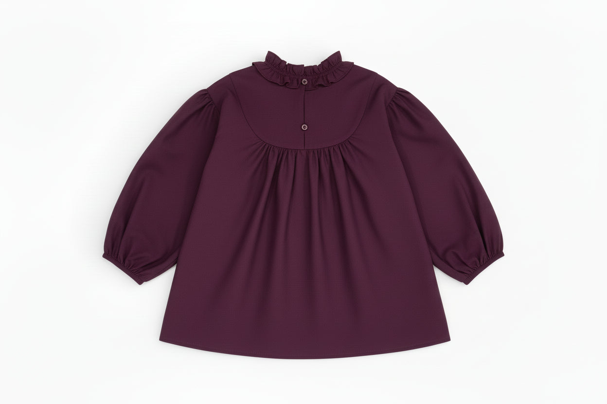 Back view of Riva Blouse showing button fastening.